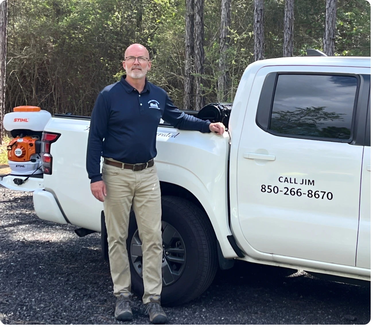 Man standing next to a white truck.